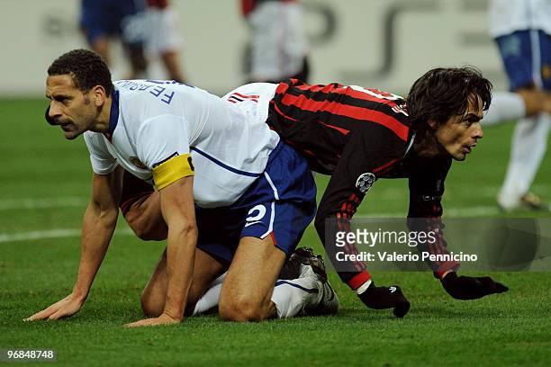 Filippo Inzaghi of AC Milan clashes with Rio Ferdinand of Manchester United during the UEFA Champions League round of 16 first leg match between AC...