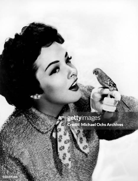 Singer and actress Kathryn Grayson poses with a budgie circa 1950 in Los Angeles, California.