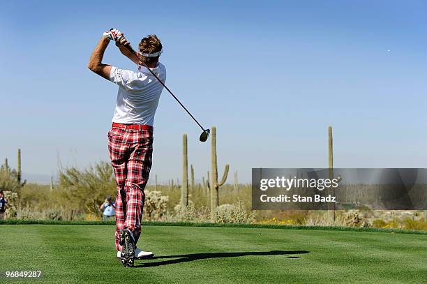 Ian Poulter of England hits a drive during the second round of the World Golf Championships-Accenture Match Play Championship at The Ritz-Carlton...