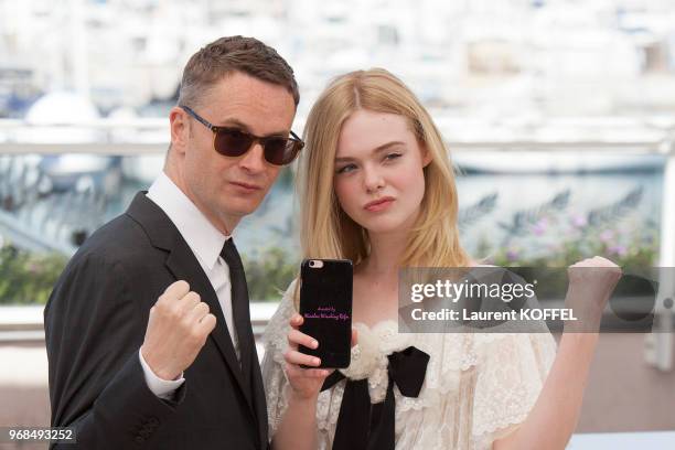 Nicolas Winding Refn and Elle Fanning attend 'The Neon Demon' Photocall during the 69th annual Cannes Film Festival at the Palais des Festivals on...