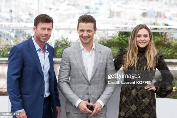 Director Taylor Sheridan, Jeremy Renner and Elizabeth Olsen attend the 'Wind River' photocall during the 70th annual Cannes Film Festival at Palais...