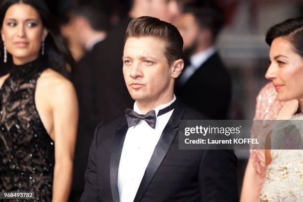 Jeremy Renner, Elizabeth Olsen and Julia Jones attend the 'The Square' screening during the 70th annual Cannes Film Festival at Palais des Festivals...