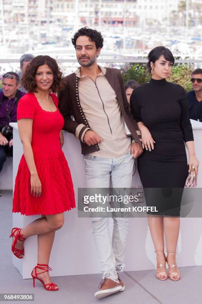 Actors Mariam Al Ferjani, Ghanem Zrelli and director Kaouther Ben Hania attend 'Alaka Kaf Ifrit ' Photocall during the 70th annual Cannes Film...