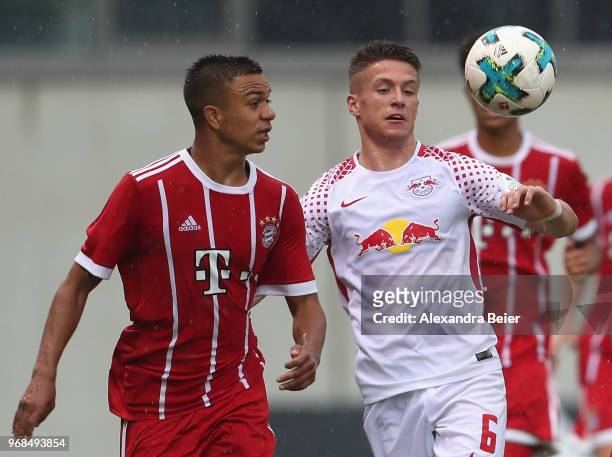 Oliver Batista Meier of FC Bayern Muenchen U17 fights for the ball with Mateusz Mackowiak of RB Leipzig U17 during the B Juniors German championship...