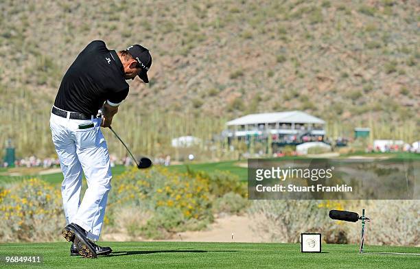 Camilo Villegas of Coumbia plays his tee shot on the 14th hole during round two of the Accenture Match Play Championship at the Ritz-Carlton Golf...