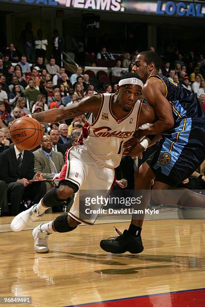 Daniel Gibson of the Cleveland Cavaliers drives to the basket against Arron Afflalo of the Denver Nuggets on February 18, 2010 at The Quicken Loans...