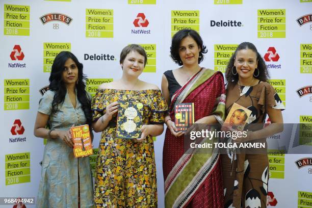 Shortlisted authors for the Women's Prize for Fiction pose with their novels India's Meena Kandasamy, Britain's Imogen Hermes Gowar, Britain's Kamila...