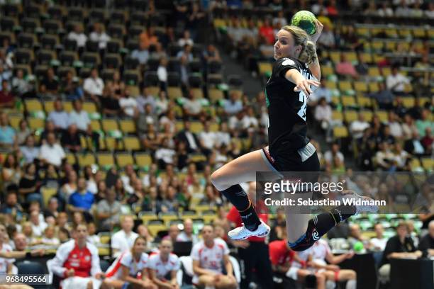 Franziska Mueller of Germany throws the ball during the Women's handball International friendly match between Germany and Poland at Olympiahalle on...