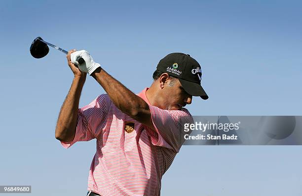 Jeev Milkha Singh of India takes a practice swing at the fifth tee box during the second round of the World Golf Championships-Accenture Match Play...