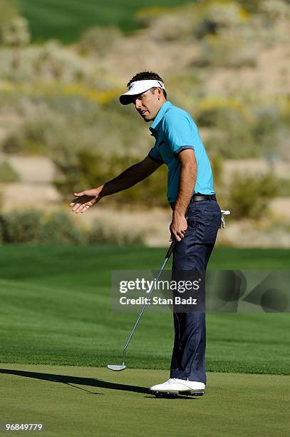 Charl Schwartzel of South Africa watches his putt at the 17th green during the second round of the World Golf Championships-Accenture Match Play...