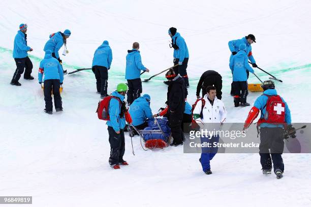 Queralt Castellet of Spain is tended to as she is prepared for transport after she was injured during a practice run for the women's snowboard...