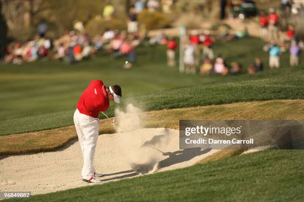 Lee Westwood of England hits out of the bunker on the 14th hole during round two of the Accenture Match Play Championship at the Ritz-Carlton Golf...