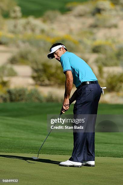 Charl Schwartzel of South Africa watches his putt at the 17th green during the second round of the World Golf Championships-Accenture Match Play...