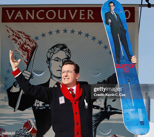 Comedian and talk show host Stephen Colbert reacts after receiving a custom made Burton snowboard from Olympic gold medalist Seth Westcott of the...