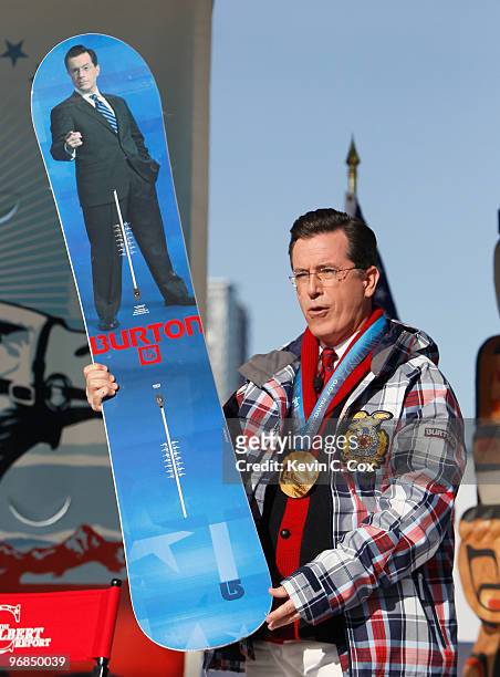 Comedian and talk show host Stephen Colbert reacts after receiving a custom made Burton snowboard from Olympic gold medalist Seth Westcott of the...