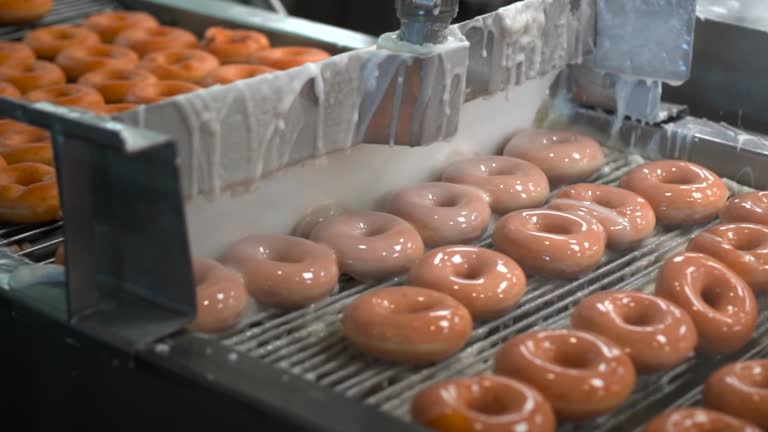 https://media.gettyimages.com/id/968506116/video/fresh-donuts-being-glazed-by-machine-in-donut-factory-assembly-line.jpg?b=1&s=640x640&k=20&c=lwysGc1jnto_YFmI4ydbA11Fg5UyEvS07Y3Y7lxc_S4=