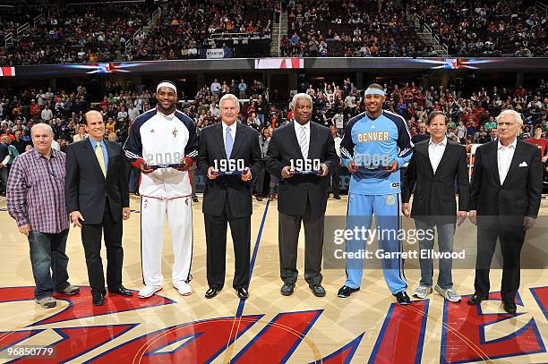 Oscar Robertson and Jerry West, co-captains of the 1960 Olympic gold medal basketball team pose for a photo with LeBron James of the Cleveland...