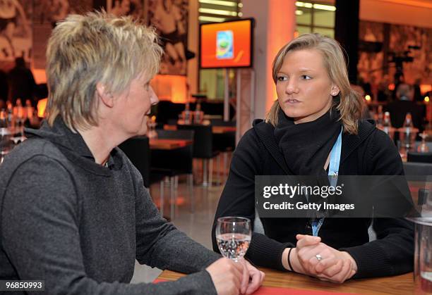 Tina Theune and Alexandra Popp are seen during an interview prior the FIFA Women's World Cup 2011 Countdown event at the Borussia Park Arena on...