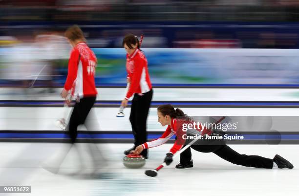 Ekaterina Galkina of Russia delivers during the curling round robin game against Great Britain on day 7 of the Vancouver 2010 Winter Olympics at...