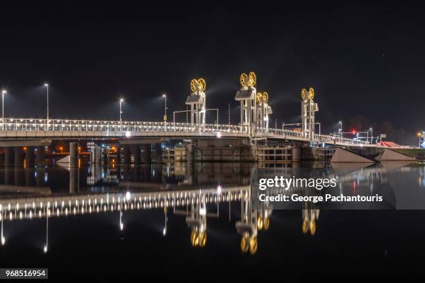 reflection of a bridge on calm river - kampen overijssel stock pictures, royalty-free photos & images