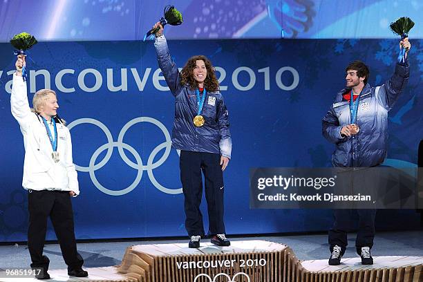 Peetu Piiroinen of Finland celebrates winning the Silver, Shaun White of United States Gold, and Scott Lago of United States Bronze during the medal...