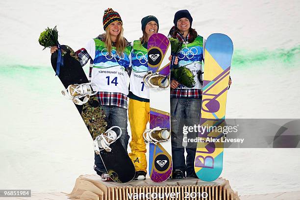 Hannah Teter of the United States celebrates winning the silver medal, Torah Bright of Australia gold and Kelly Clark of the United States bronze...