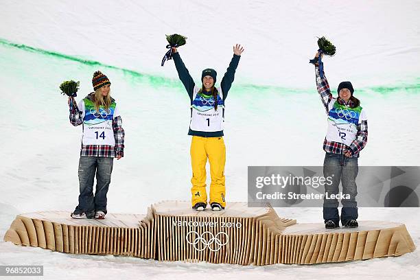 Hannah Teter of the United States celebrates winning the silver medal, Torah Bright of Australia gold and Kelly Clark of the United States bronze...