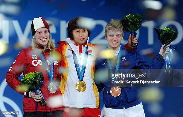 Marianne St-Gelais of Canada celebrates winning Silver, Wang Meng of China, Gold, and Arianna Fontana of Italy, Bronze during the medal ceremony for...