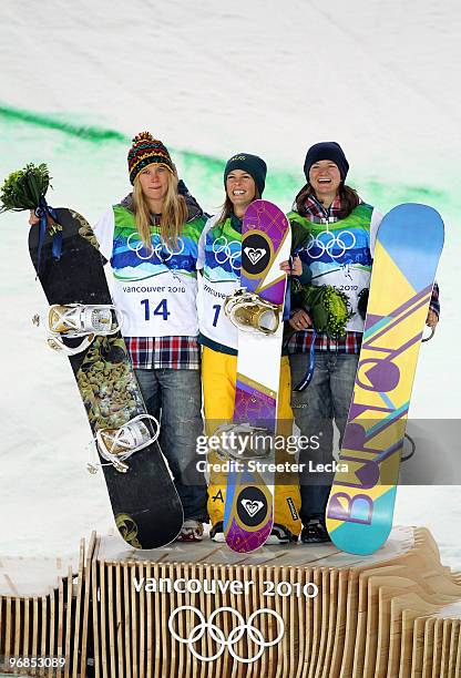 Hannah Teter of the United States celebrates winning the silver medal, Torah Bright of Australia gold and Kelly Clark of the United States bronze...