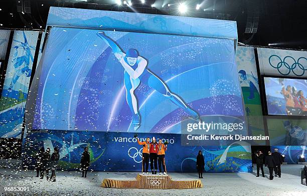 Annette Gerritsen of Netherlands celebrates winning Silver, Christine Nesbitt of Canada Gold, and Laurine Van Riessen of Netherlands Bronze during...