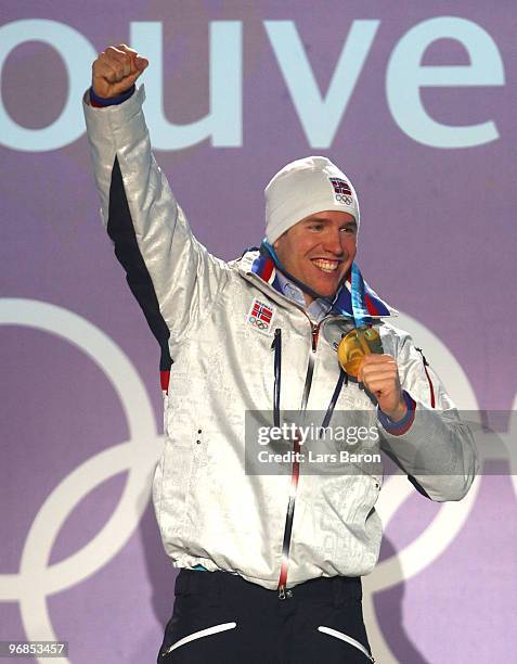 Emil Hegle Svendsen of Norway celebrates winning the gold during the medal ceremony for the Men�s 20km Individual Biathlon on day 7 of the Vancouver...