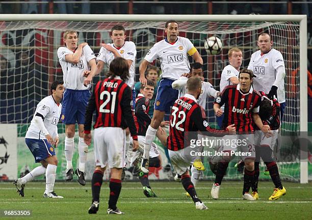 David Beckham of AC Milan takes a free-kick during the UEFA Champions League First Knock-Out Round match between AC Milan and Manchester United at...