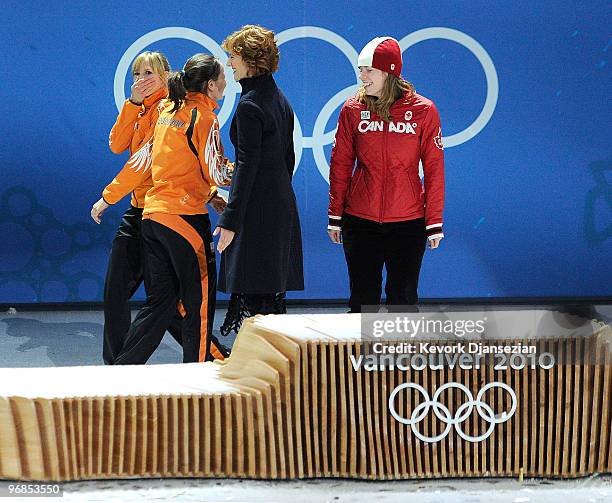 Annette Gerritsen of Netherlands celebrates winning Silver, Christine Nesbitt of Canada Gold, and Laurine Van Riessen of Netherlands Bronze during...