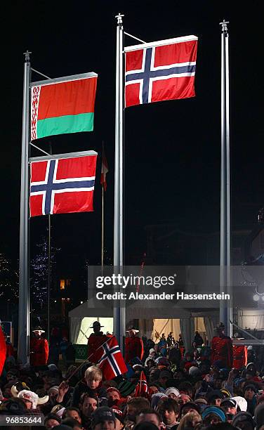 The flags of Belarus and Norway are raised together as their were two silver medals awarded to Ole Einar Bjoerndalen of Norway and Sergey Novikov of...