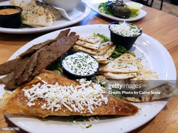 greek gyro and spanikopita - joghurtsoße stock-fotos und bilder
