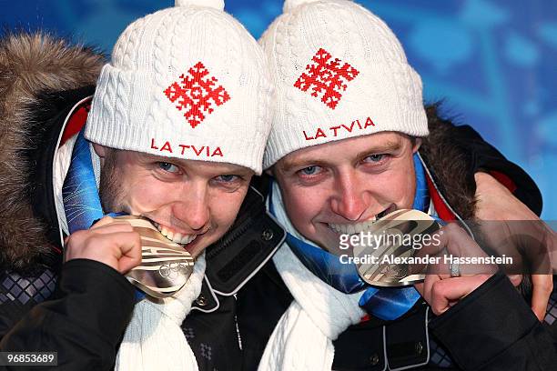 Andris Sics and Juris Sics of Latvia celebrate winning the silver medal during the medal ceremony for the Men�s Doubles� Luge on day 7 of the...