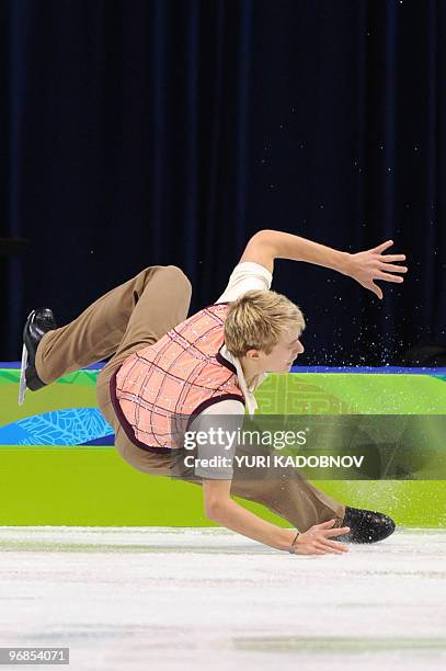 Czech Republic's Michal Brezina falls down as he performs in the Men's Figure skating free program at the Pacific Coliseum in Vancouver during the...