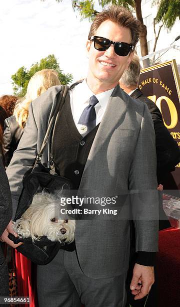 Musician Chris Isaak and his dog Rodney attend Roy Orbison's induction into the Hollywood Walk Of Fame on January 29, 2010 in Hollywood, California.