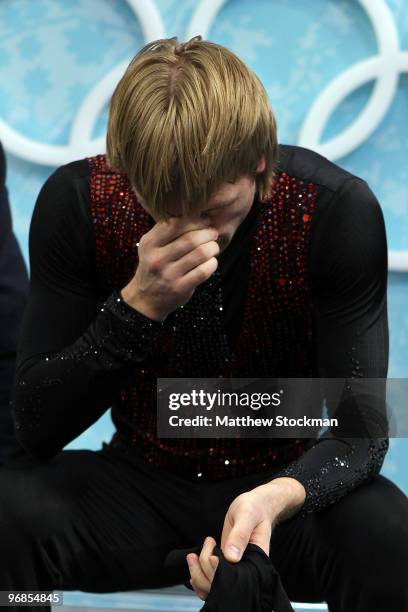 Evgeni Plushenko of Russia looks dejected in the kiss and cry area in the men's figure skating free skating on day 7 of the Vancouver 2010 Winter...