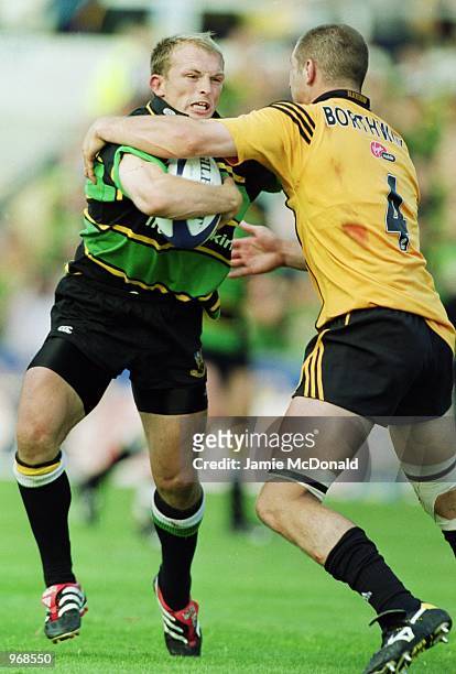 Matt Dawson of Northampton is tackled by Steve Borthwick of Bath during the Zurich Premiership match played at Franklins Gardens, in Northampton,...