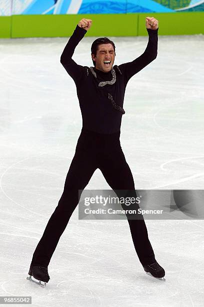 Evan Lysacek of the United States celebrates on his way to winning the gold medal in the men's figure skating free skating on day 7 of the Vancouver...