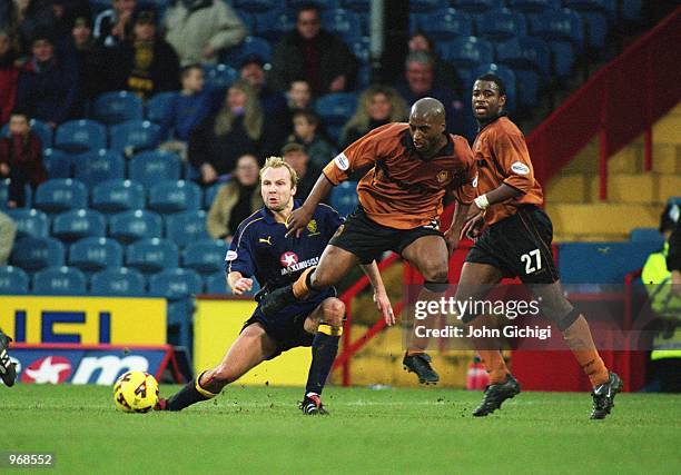 Dean Sturridge of Wolves is tackled by Hakan Mild of Wimbledon during the Nationwide Division One match between Wimbledon and Wolverhampton Wanderers...
