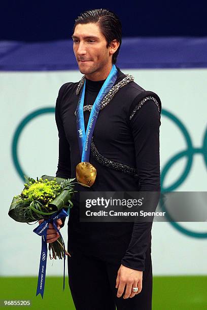 Evan Lysacek of the United States poses after winning the gold medal in the men's figure skating free skating on day 7 of the Vancouver 2010 Winter...
