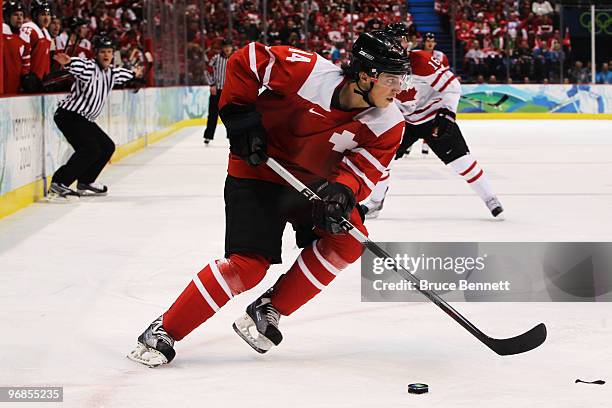 Roman Wick of Switzerland handles the puck during the ice hockey men's preliminary game between Switzerland and Canada on day 7 of the 2010 Winter...