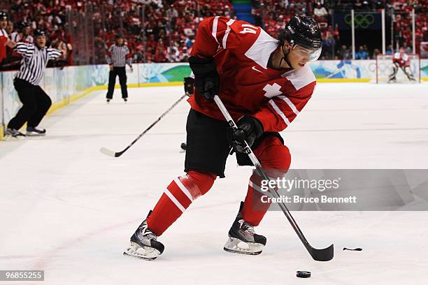 Roman Wick of Switzerland handles the puck during the ice hockey men's preliminary game between Switzerland and Canada on day 7 of the 2010 Winter...