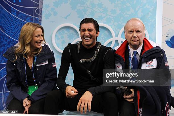 Evan Lysacek of the United States reacts as he sits in the kiss and cry area on the way to winning the gold medal after he competed in the men's...