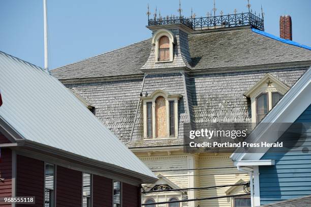 Robert Indiana's Vinalhaven home the former Odd Fellows Hall named Star of Hope with some of the windows boarded up Wednesday, May 23, 2018.