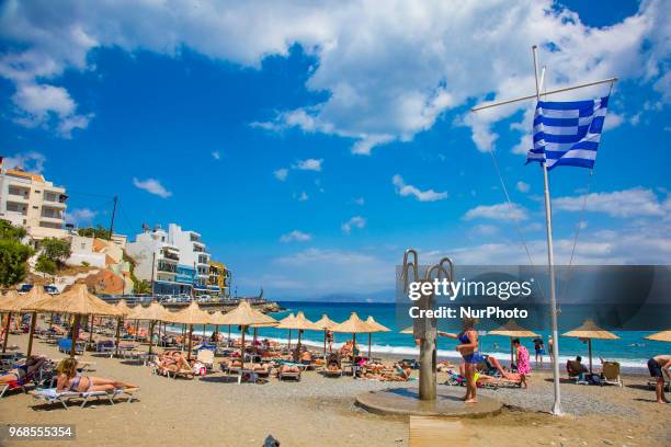 Kitroplateia Beach in Agios Nikolaos town in Crete island in Greece. This beach awarded with the Blue Flag has transparent crystal clear water in the...