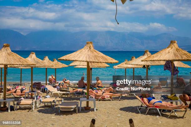 Kitroplateia Beach in Agios Nikolaos town in Crete island in Greece. This beach awarded with the Blue Flag has transparent crystal clear water in the...