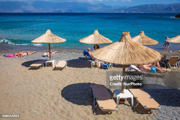 Kitroplateia Beach in Agios Nikolaos town in Crete island in Greece. This beach awarded with the Blue Flag has transparent crystal clear water in the...